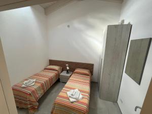 Postel nebo postele na pokoji v ubytování Luciano Home