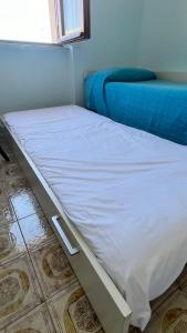 Postel nebo postele na pokoji v ubytování Casa Luigi
