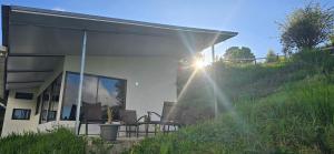a building with a table and chairs on a patio at Volcano Panoramic Views in Vara Blanca
