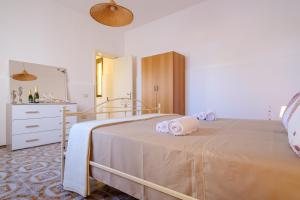 Posteľ alebo postele v izbe v ubytovaní Villa Grecale Porto Cesareo