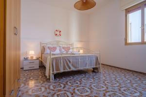 Posteľ alebo postele v izbe v ubytovaní Villa Grecale Porto Cesareo