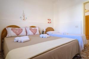 Posteľ alebo postele v izbe v ubytovaní Villa Grecale Porto Cesareo