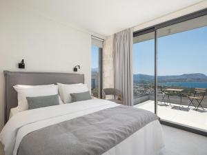 Postel nebo postele na pokoji v ubytování PhantΩm Villas Villa Kateena + 49 fotografií