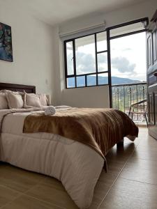 Postel nebo postele na pokoji v ubytování Casa Candelaria Hotel