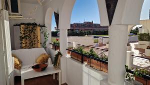 a balcony with a couch and plants on it at Beautiful apartment in Calahonda beach in Sitio de Calahonda