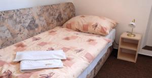 Postel nebo postele na pokoji v ubytování Hotel Valaskuv Grunt