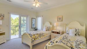 a bedroom with two beds and a window at Luxury Family Home with Ocean Views, Pool, Wet Bar, BBQ in Hilton Head Island +65 photos