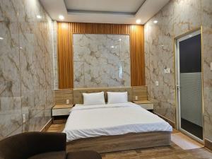 A bed or beds in a room at Vung Tau Villa mini sát biển - Gitico Homestay