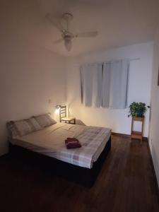 Katil atau katil-katil dalam bilik di Quarto aconchegante