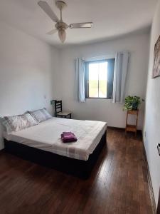 Katil atau katil-katil dalam bilik di Quarto aconchegante