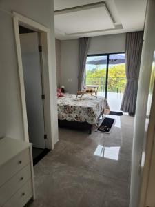 Postel nebo postele na pokoji v ubytování Casa di Palmas