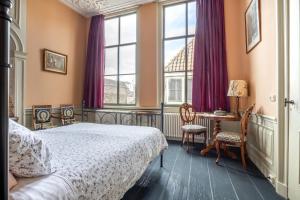 Postel nebo postele na pokoji v ubytování B&B In de Prinsenstraat