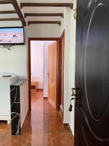 a hallway with a door leading to a room at Casa Abdou in Chefchaouene
