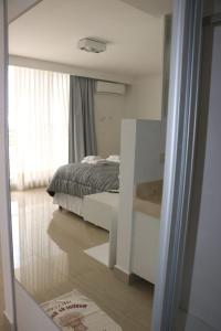 Ένα ή περισσότερα κρεβάτια σε δωμάτιο στο Dpto MIRADOR DEL RIO +7 φωτογραφίες