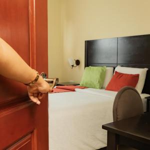 Postel nebo postele na pokoji v ubytování Hotel Las Hamacas