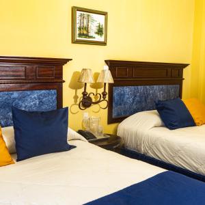Postel nebo postele na pokoji v ubytování Hotel Las Hamacas