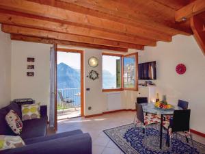 a living room with a couch and a table at Soffio Di Rugiada in Fonteno +10 photos