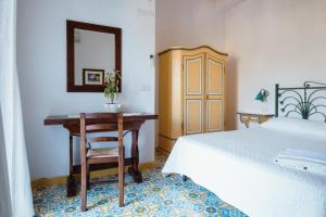 Postel nebo postele na pokoji v ubytování B&B Orto Paradiso