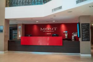 a restaurant with a red counter in a building at Mérit San Telmo by Amérian in Buenos Aires