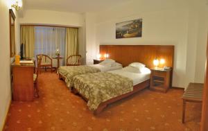 Postel nebo postele na pokoji v ubytování Hotel Emma West + 22 fotografií