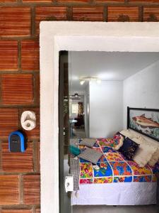 a bedroom with a bed in a room at Suíte 6 - Village Capixaba in Gravatá