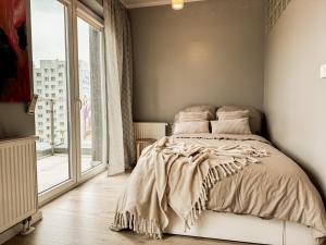 Ένα ή περισσότερα κρεβάτια σε δωμάτιο στο Great view, 5 minutes Rynek, UWr