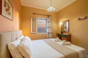 Postel nebo postele na pokoji v ubytování Eleftheria Apartments