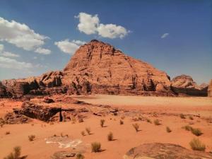 a large rock formation in the desert at Wadi Rum Thamer in Wadi Rum