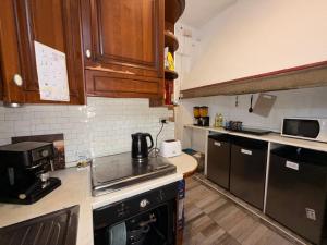 a kitchen with a sink and a stove top oven at My Friends in Florence