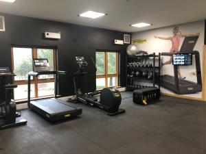 a gym with a woman on a poster on the wall at Fell View in Troutbeck