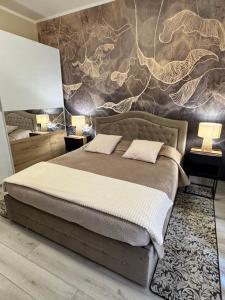 a bedroom with a bed with a wall mural at Verona green harmony in Verona