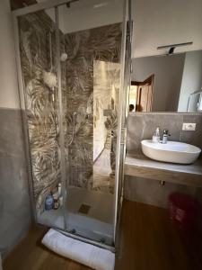 a bathroom with a shower and a sink at My Friends in Florence