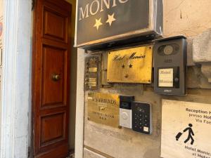 a pay meter on the side of a building at My Friends in Florence