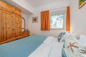Una cama o camas en una habitación de Südwind 23 12 fotos más