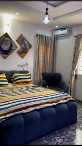 Postel nebo postele na pokoji v ubytování Sea-Love Apartment In Ado-Ekiti