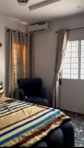 Postel nebo postele na pokoji v ubytování Sea-Love Apartment In Ado-Ekiti