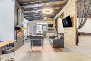 a living room with a couch and a table at Georgia Farmhouse Studio with Hiking Trail in Lithonia