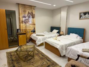 Krevet ili kreveti u jedinici u objektu Hapi Pyramids Hotel
