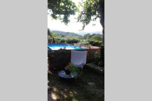 a view of a yard with a swimming pool at la maison d'Anna chambres d hôtes in Ganac