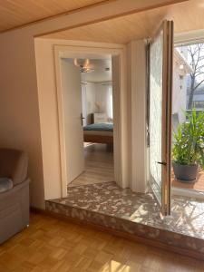 a room with a door leading to a bedroom at Apartment Salvete in Sulzbach-Rosenberg +17 photos