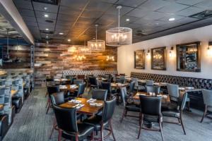 a restaurant with tables and chairs in a room at Cozy Private Rm Near Beach Travelers Welcome J1A shared home in Sarasota