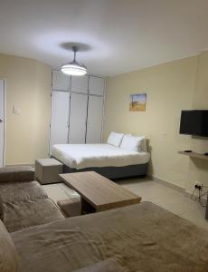 a living room with a bed and a couch at Oceanic 108 in Durban