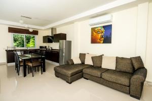 a living room with a couch and a table at Platinum Residence Villa in Rawai Beach