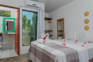 Postel nebo postele na pokoji v ubytování Vila Anauá
