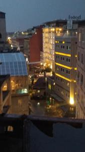 a view of a city at night with buildings at Αnchor Suites in Thessaloniki