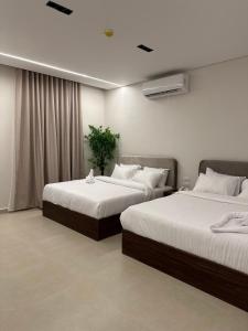 Postel nebo postele na pokoji v ubytování Imperial Hotel