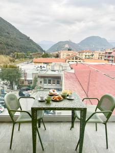 a table with food on top of a balcony at Apartment Prestige in Finale Ligure