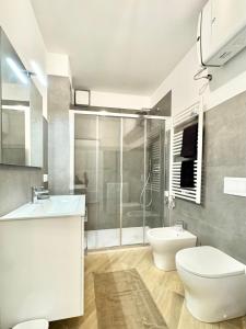 a bathroom with a toilet and a sink and a shower at Apartment Prestige in Finale Ligure +31 photos