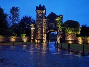 an entrance to a stone building with an arch at Belleek Lodge in Ballina