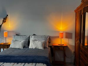 Una cama o camas en una habitación de Studio Relâmpago